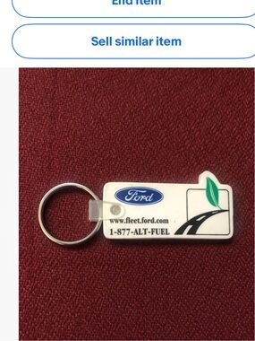 Vintage Ford White Keychain with Green Leaf and Blue Logo